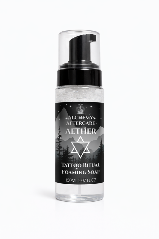 Foaming soap bottle with black label featuring a star design on a white background