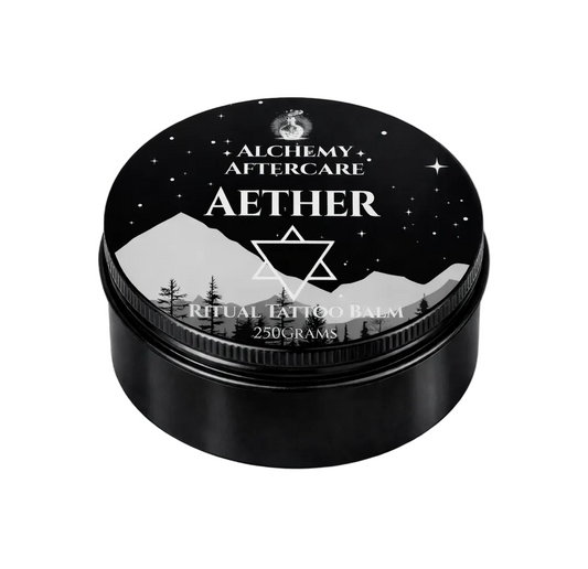 Alchemy Aftercare Aether Ritual Tattoo Balm container with mountain and star design on a white background