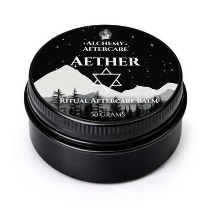 Black jar of Alchemy Aftercare Aether Ritual Aftercare Balm with mountain and star design on lid.