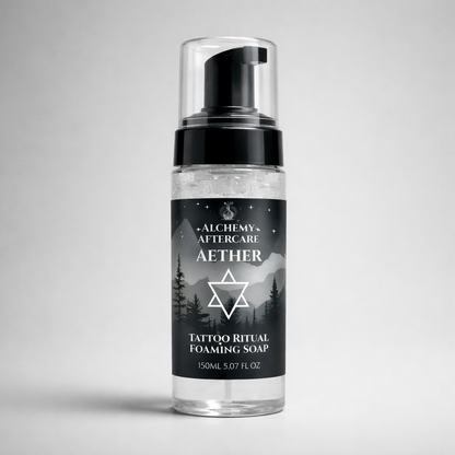 Aether Fragrance Free Tattoo Foaming Cleanser for fresh tattoos in reusable foaming bottle, grey background