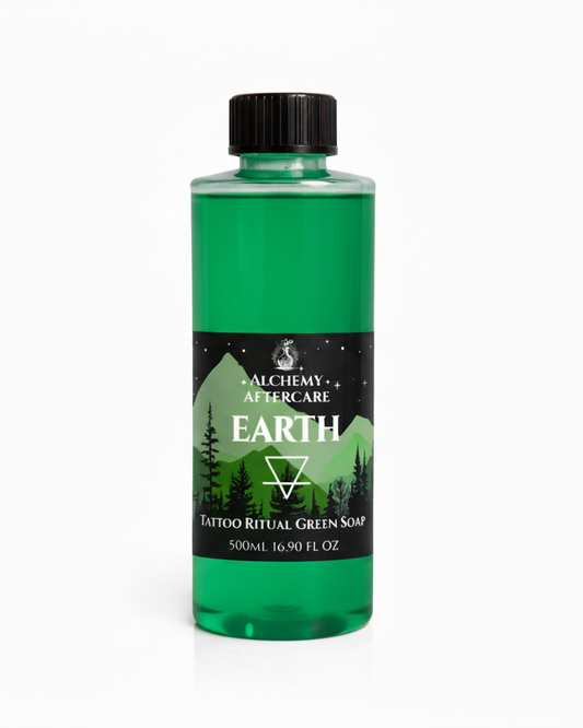 Green bottle of tattoo soap with black cap on a white background