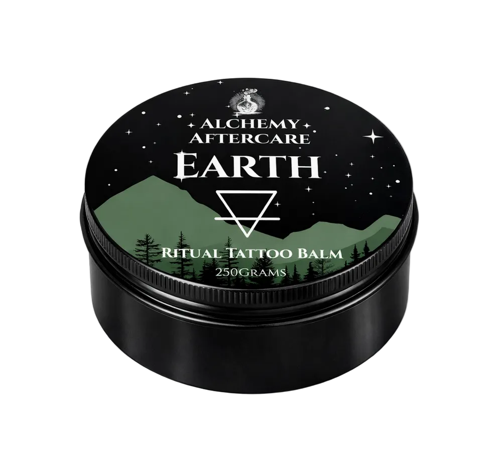 Black container of Alchemy Aftercare Earth Ritual Tattoo Balm with mountain and forest design on lid.