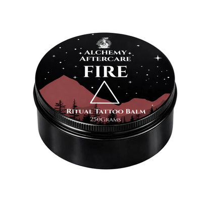Black container of Alchemy Aftercare Fire Ritual Tattoo Balm with mountain and star design on lid.