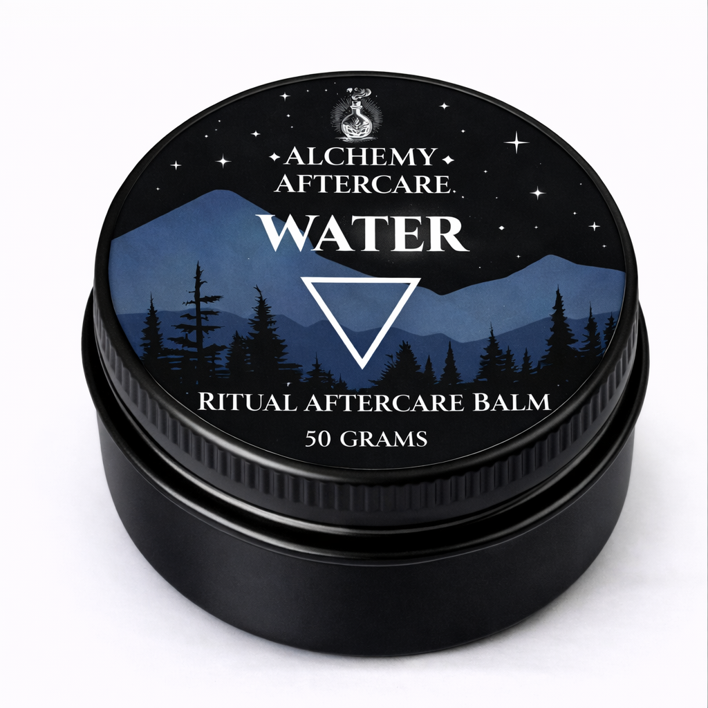 Black container of Alchemy Aftercare Ritual Aftercare Balm with mountain and forest design on the lid.